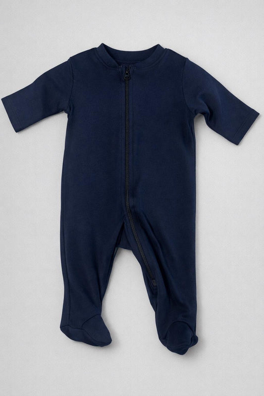 Navy blue baby onesie with a zipper on a light gray background